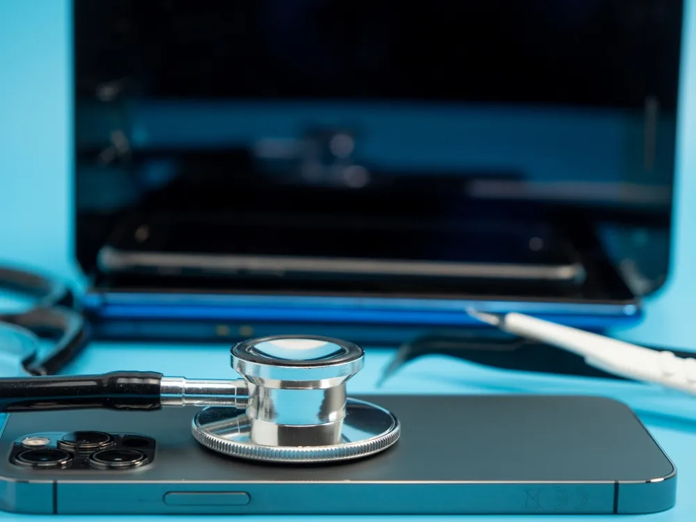 stethoscope on a mobile phone near desktop