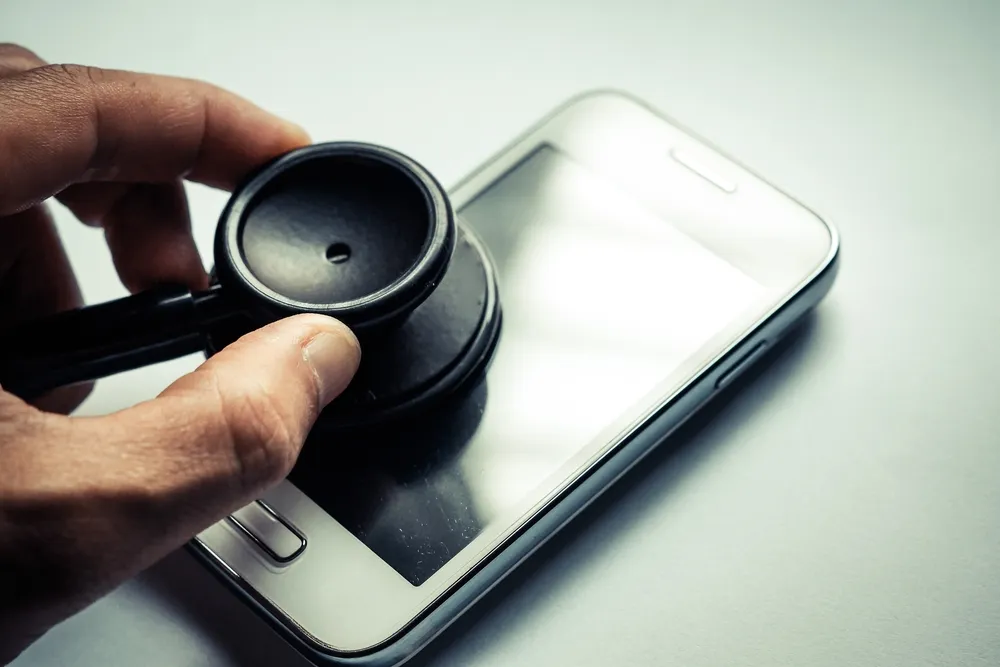 stethoscope listening to an iphone