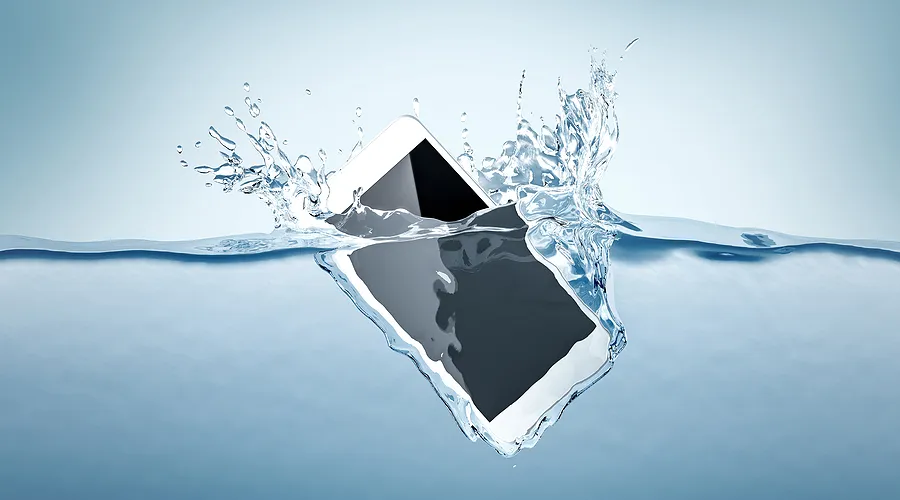 Mobile phone submerged in water.